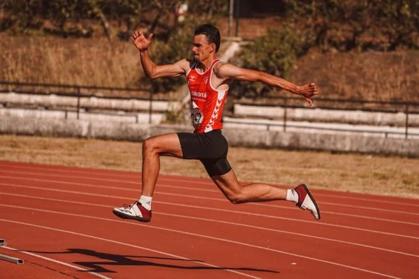 athlete running approach jump
